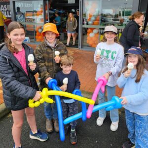 Children holding balloon swords