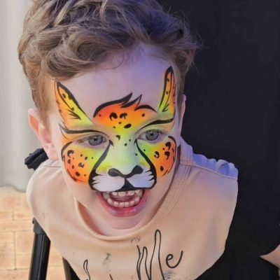 A child with a Cheetah face paint